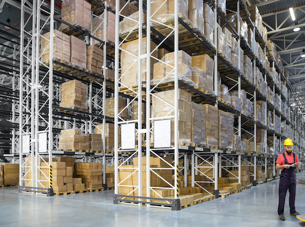 A worker in a huge distribution warehouse