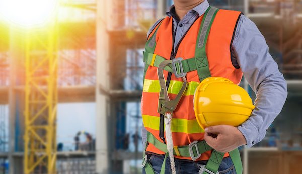 engineer wear fall arrest equipment on site background